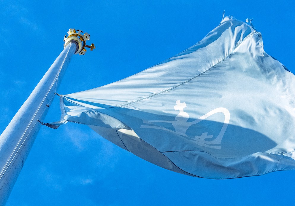 A flag featuring the Columbia crown flying in the breeze.